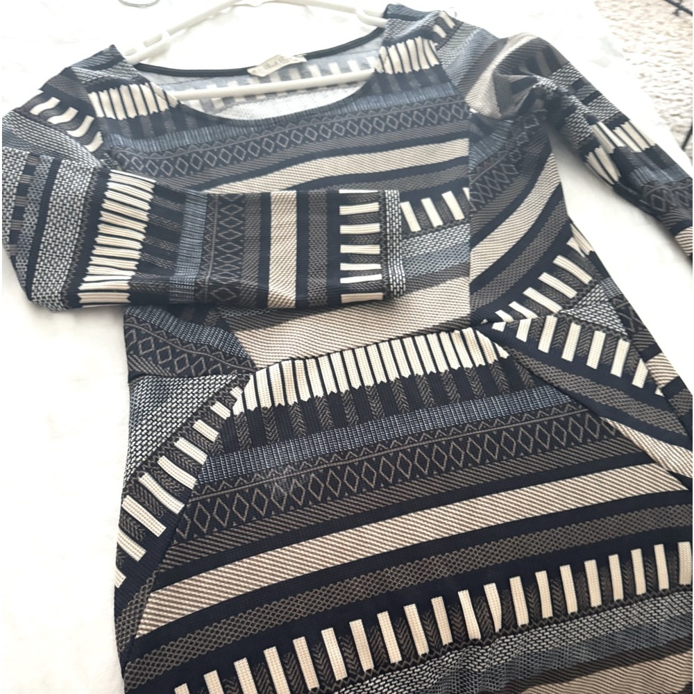 Multi colored bodycon, mini and form fitting. This dress hugscurves.